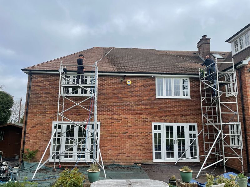 Roof cleaning carried out safely from scaffold towers by The Roof Moss Cleaners in Hungerford